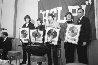 The Beatles Holding Gold Records