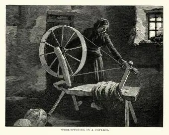 kvinna spinner ull