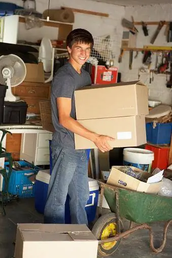 Teenage Boy Moving Boxes