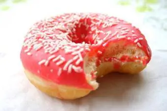 Pink donut nrog sprinkles.